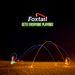 A nighttime beach scene shows glowing trails from a Foxtail LED tossed in motion, people enjoying this fun outdoor game, with the text “Foxtail LED Gets Everyone Playing!” displayed in white and green above.